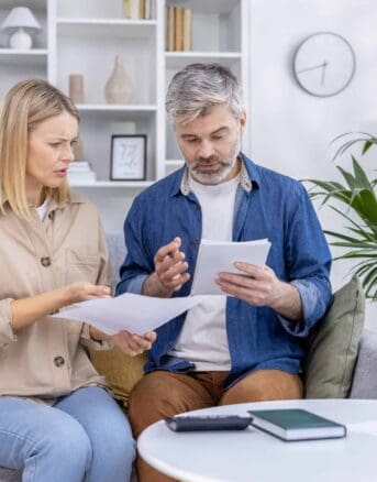Couple Reviewing IRS Notice CP89 Together at Home