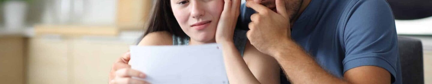 Couple Upset Reading IRS Notice CP14G Together