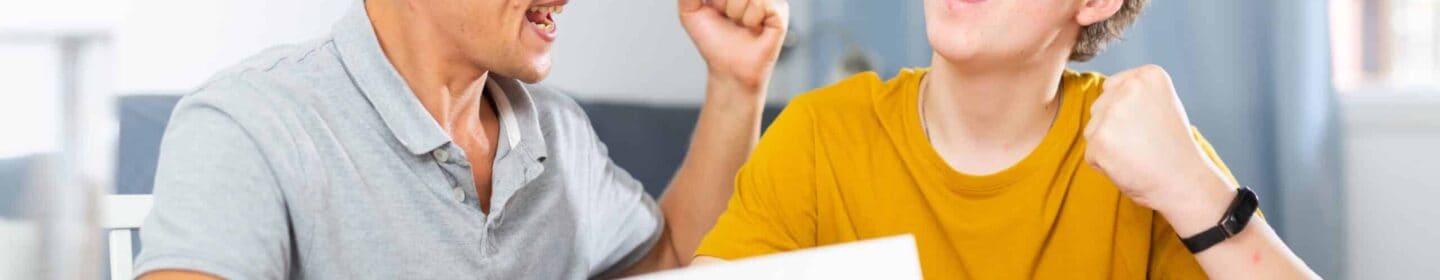 Father and Son Celebrating the Good News in IRS Notice CP74