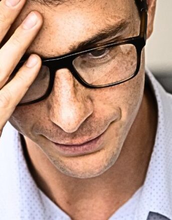 Man Anxiously Reading IRS Notice CP081B