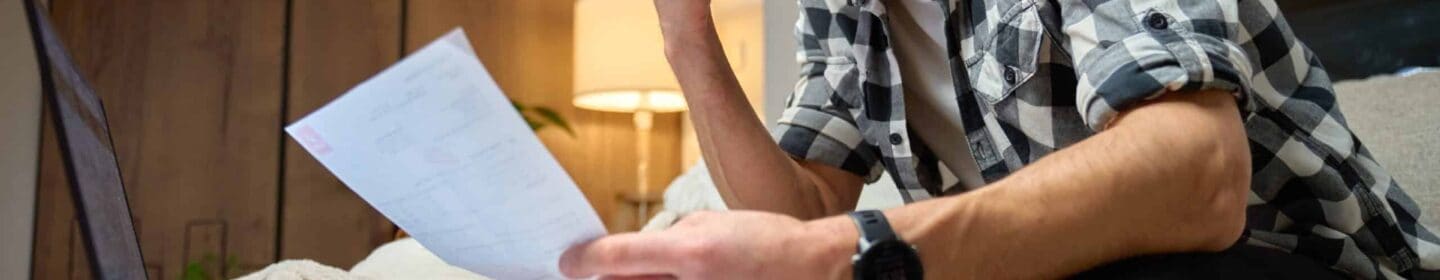 Man Overwhelmed by Paperwork After Receiving IRS Letter 729