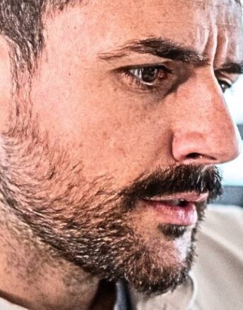 Man Reading IRS Notice CP13