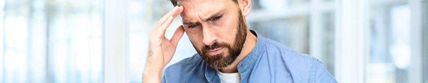 Man Stressed Out While Reading IRS Letter 1058