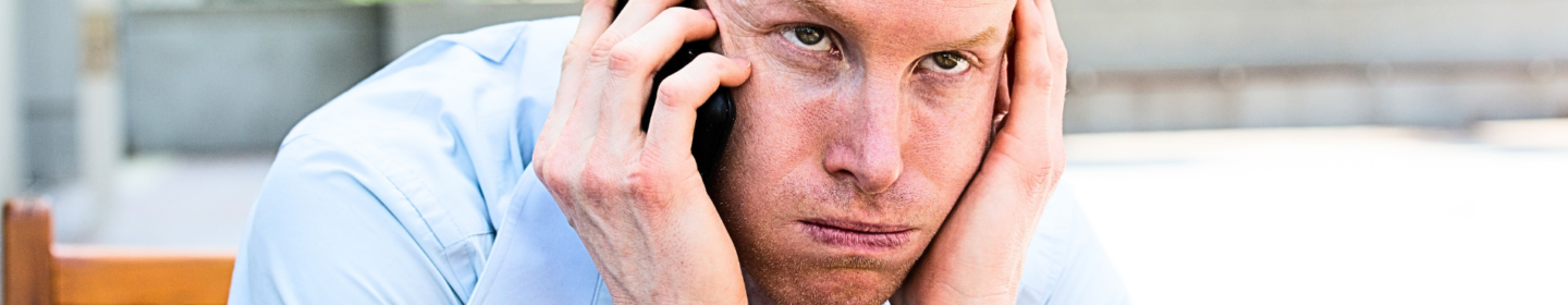 Man is irritated by receiving calls from the IRS.
