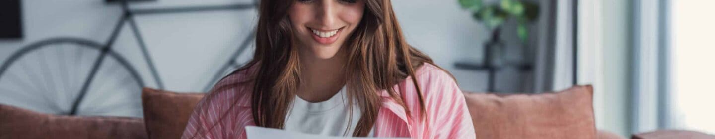 Woman Smiling as She Reads IRS Letter 6459C